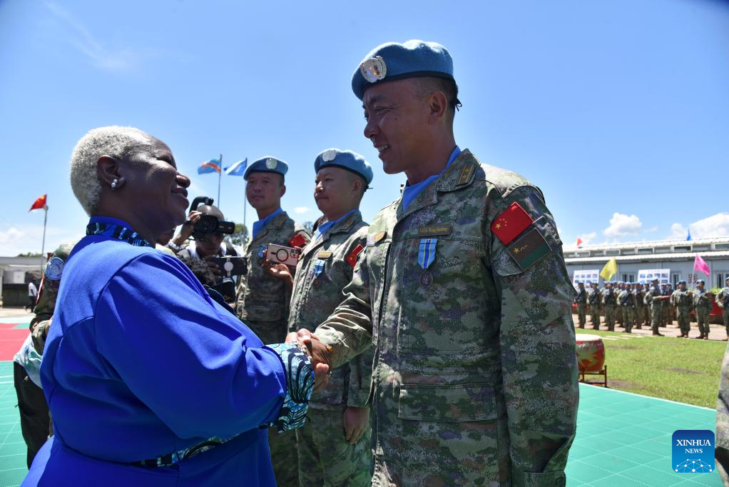 Bintou Keita (L), the top UN envoy in the DRC who heads the MONUSCO, shakes hands with a member of the Chinese peacekeepers at the camp of the engineering company of the Chinese contingent on the outskirts of Bukavu, the capital of the eastern province of South Kivu, the DRC, April 9, 2024. /Xinhua