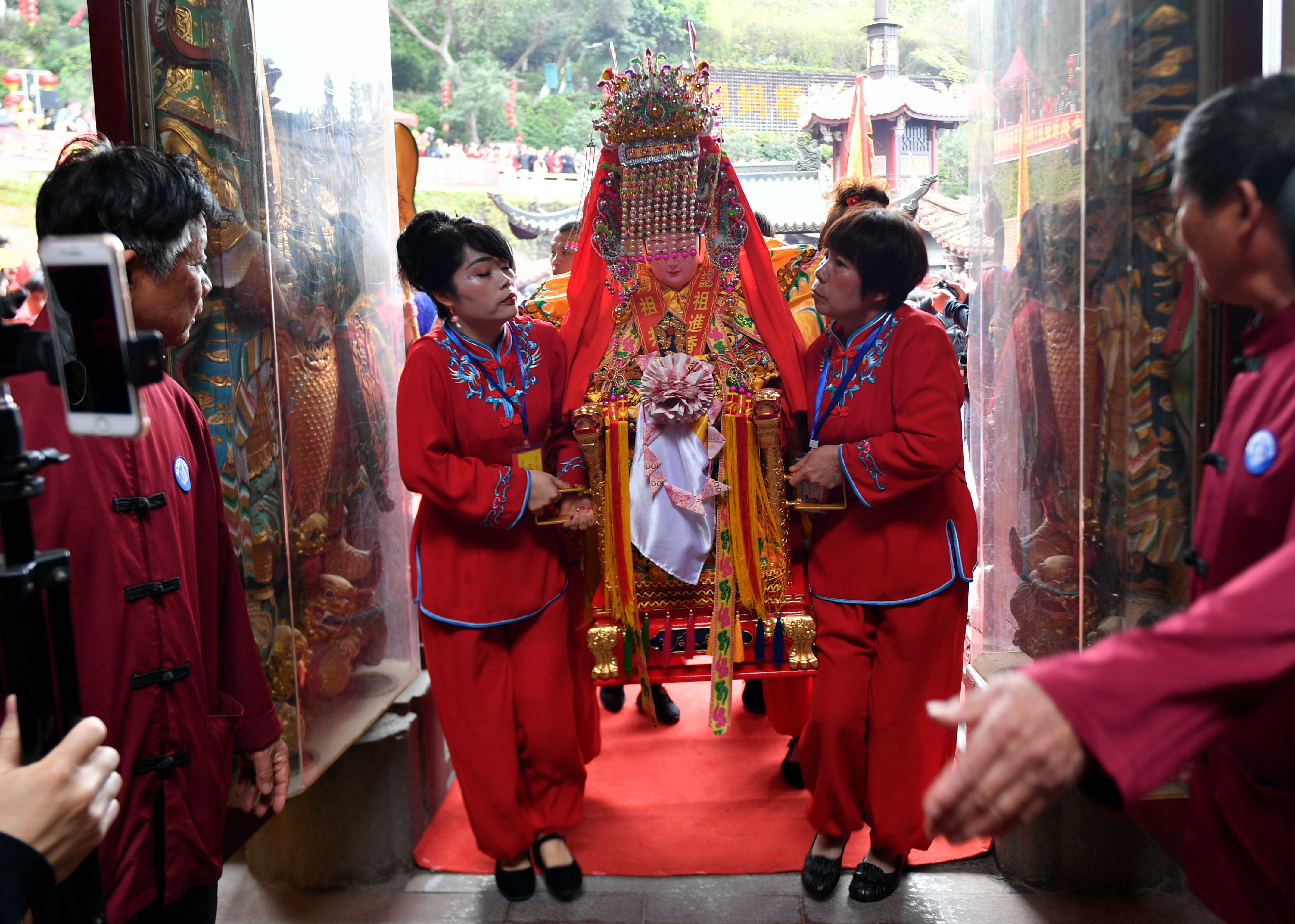 Mazu statues from across the world are taken into the Mazu Temple on Meizhou Island in Fujian Province on April 9, 2024. /IC