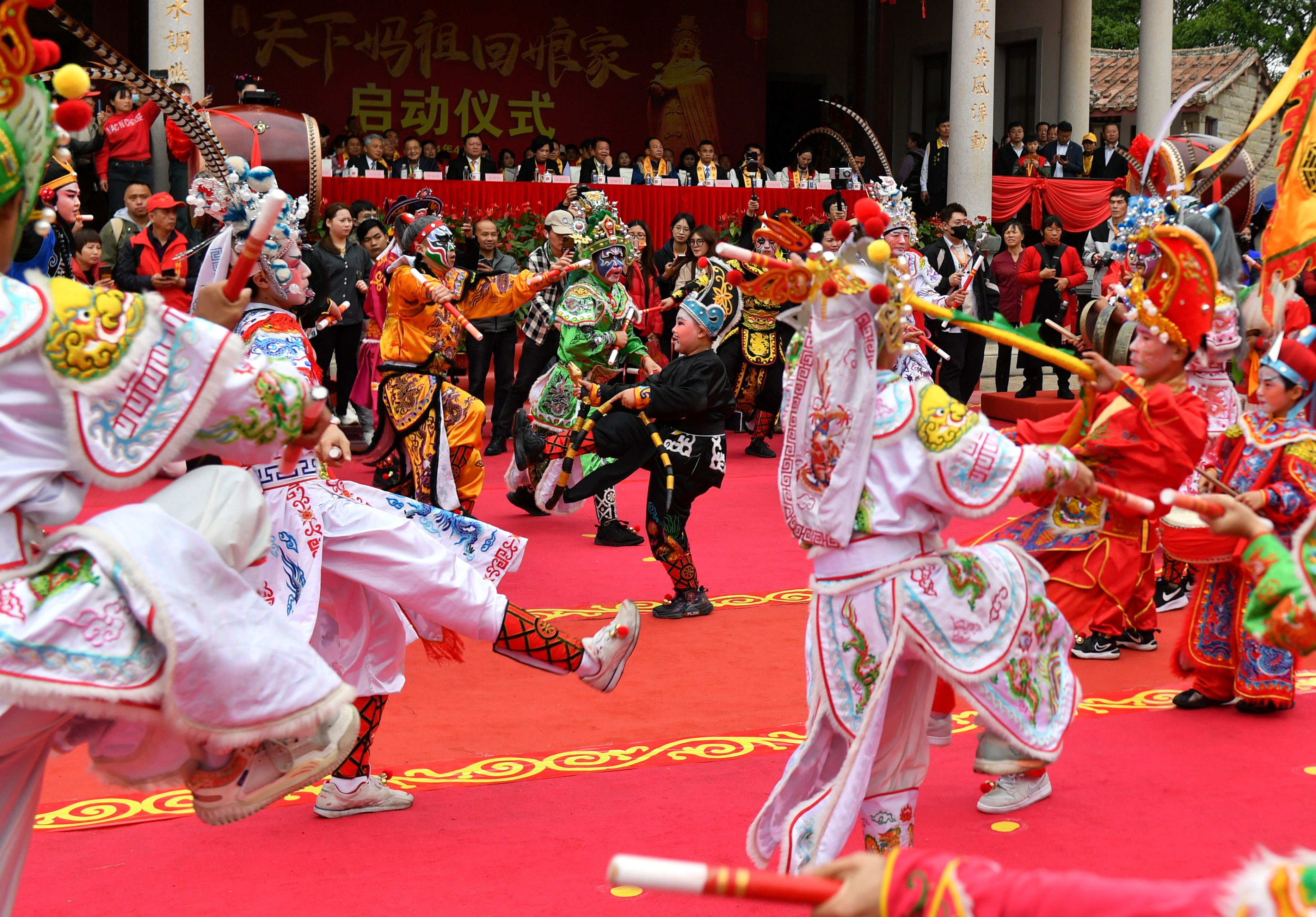 Yingge, a traditional dance form of the Han ethnic group, is performed during the ceremony of welcoming Mazu statues from across the world back to the goddess's place of origin on Meizhou Island in Fujian Province on April 9, 2024. /IC