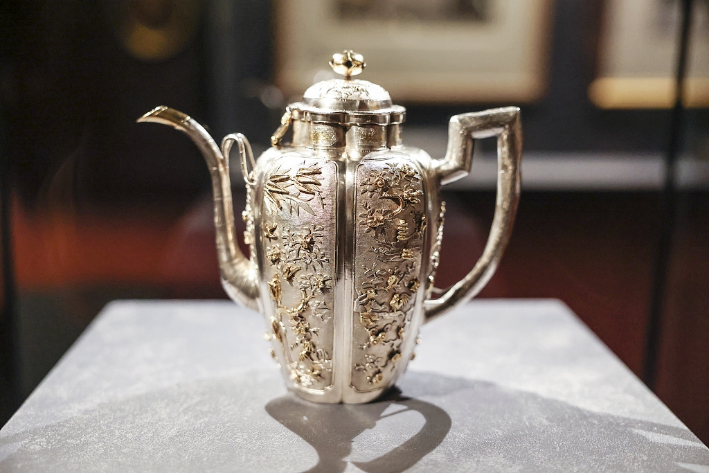 A China made gold-plated silver coffee pot is seen at the exhibition 