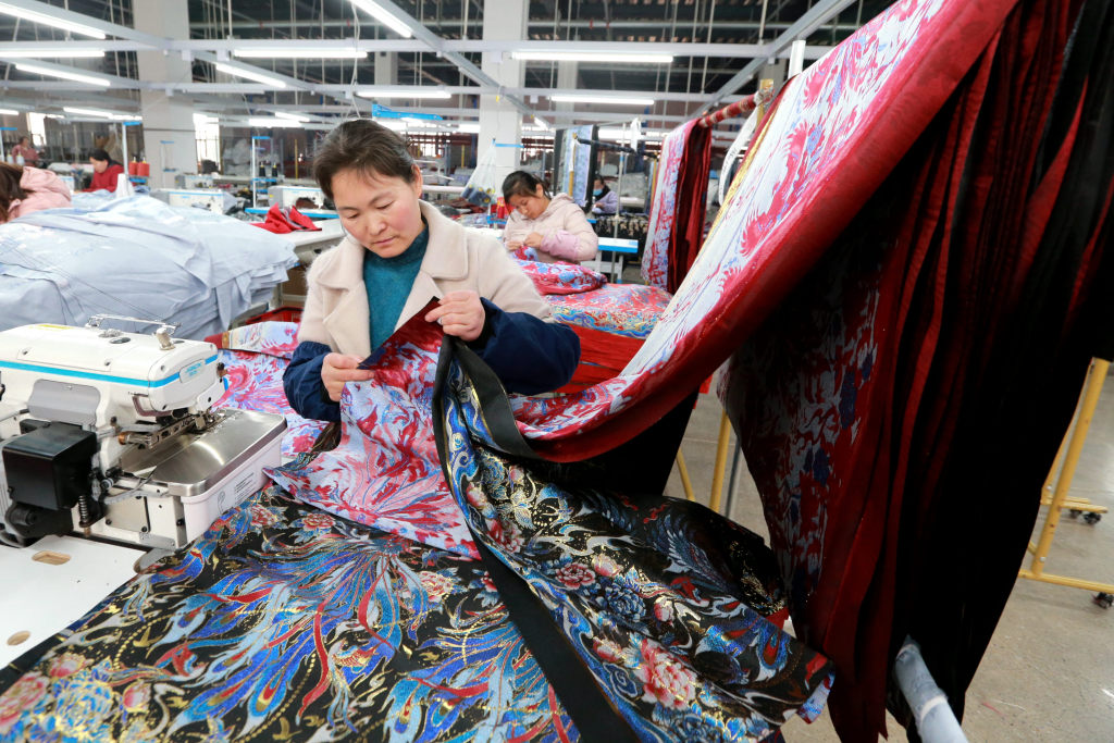 The production line of horse-face skirts is pictured in Caoxian County, Shandong Province on March 4, 2024. /CFP