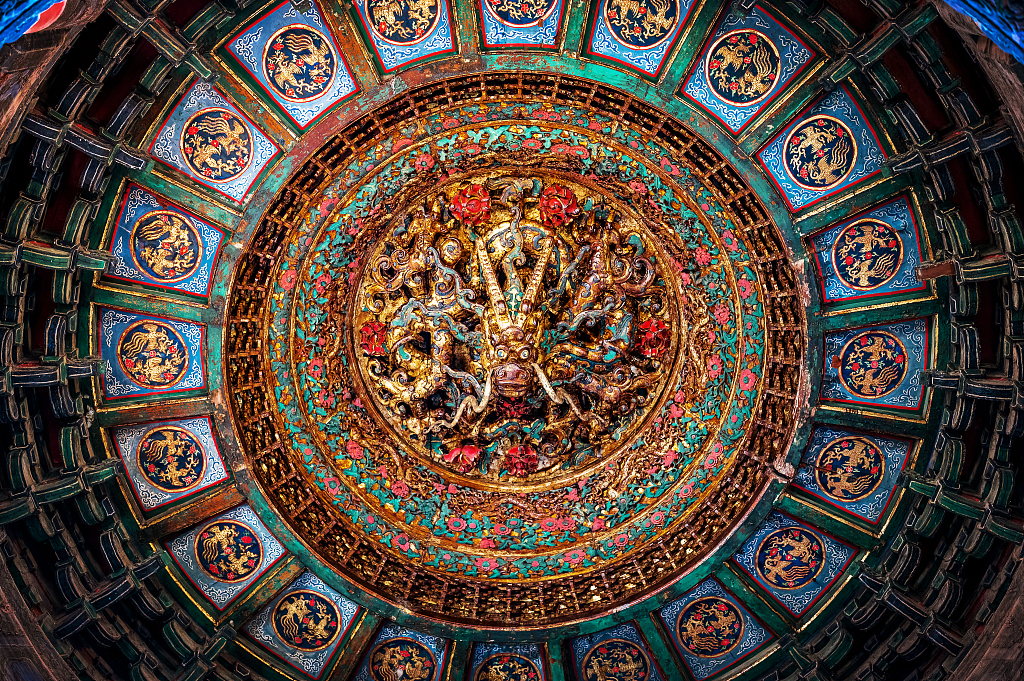 The caisson ceiling of the Ten Thousand Springs Pavilion in the Imperial Garden at the Palace Museum, also known as the Forbidden City, in Beijing features a dragon. /CFP