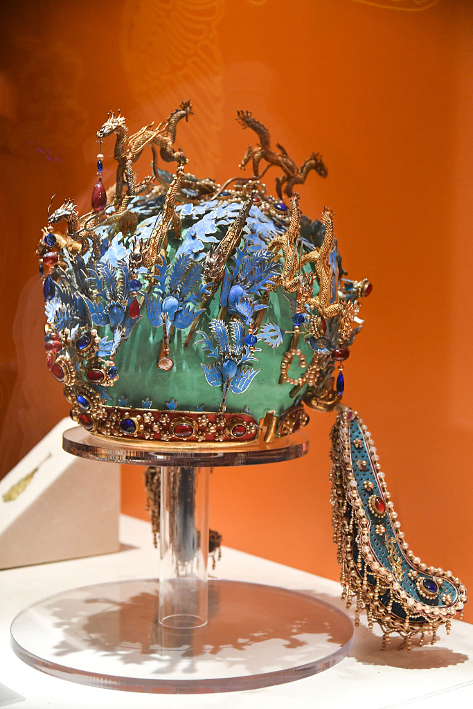 The crown with twelve dragons and nine phoenixes of Empress Xiaojing of the Ming Dynasty (1368-1644) from the collection of the Ming Tombs Museum is displayed at the National Museum of Classic Books in Beijing on May 10, 2023. /CFP