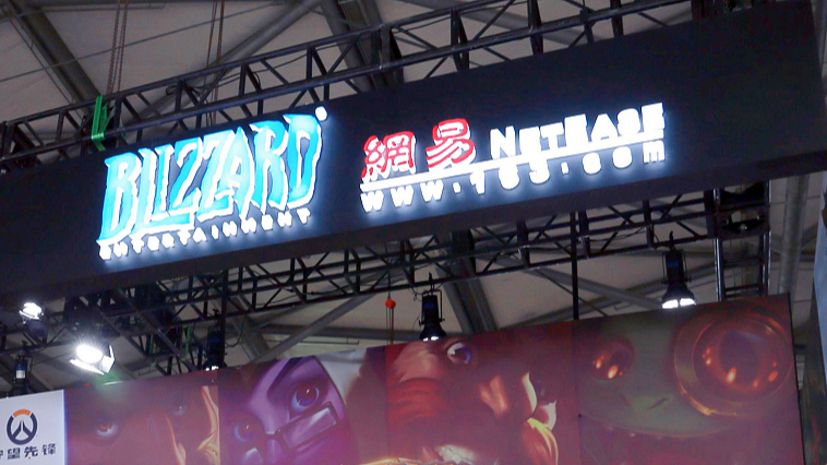 The logos of Blizzard Entertainment and NetEase at an expo in Shanghai, China, August 2, 2019. /CFP