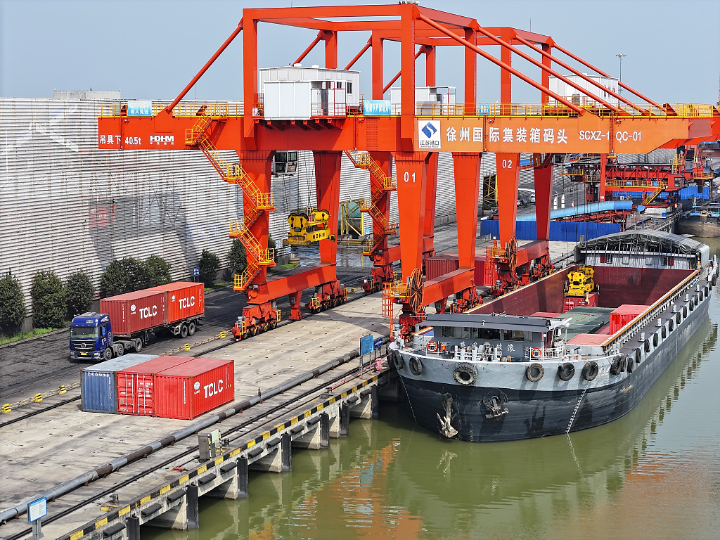 Cargo ships loading and unloading at the dock in Xuzhou Port, east China's Jiangsu Province, April 11, 2024. /CFP