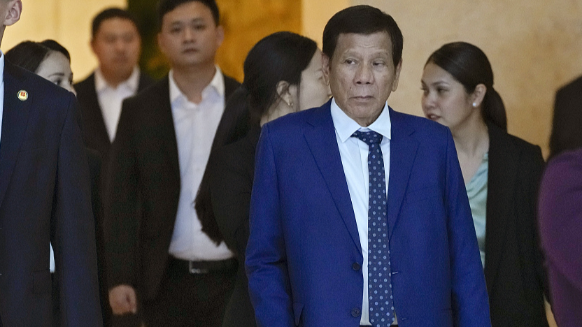 File photo of former Philippine President Rodrigo Duterte (R), escorted by officials as he leaves a hotel in Beijing, July 17, 2023. /CFP