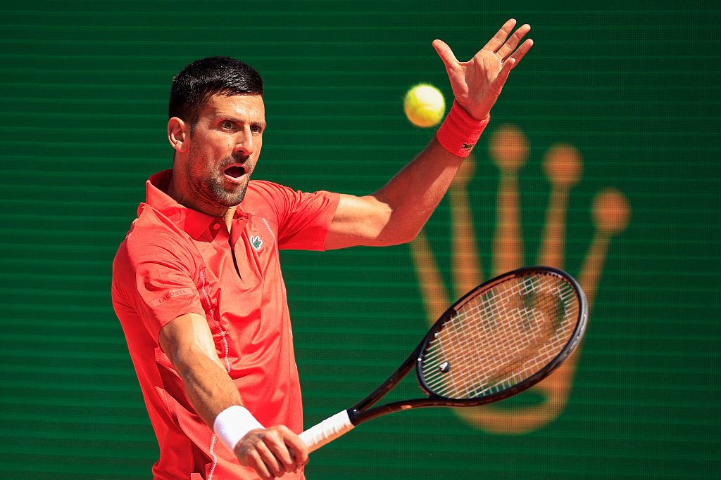 Serbia's Novak Djokovic plays a backhand return to Italy's Lorenzo Musetti during their clash at the Monte Carlo Country Club, Monaco, April 11, 2024. /CFP  