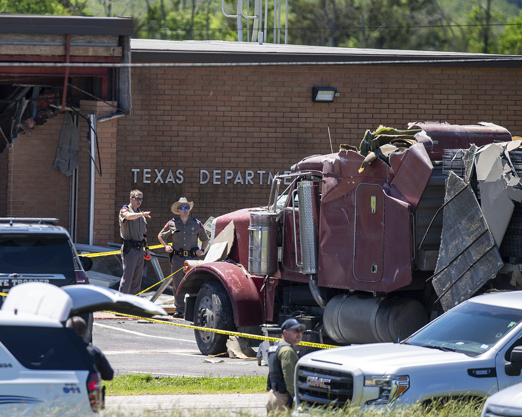 First responders on the scene after a stolen semitrailer crashed into a Texas Department of Public Safety office in Brenham, Texas, U.S., April 12, 2024. /CFP