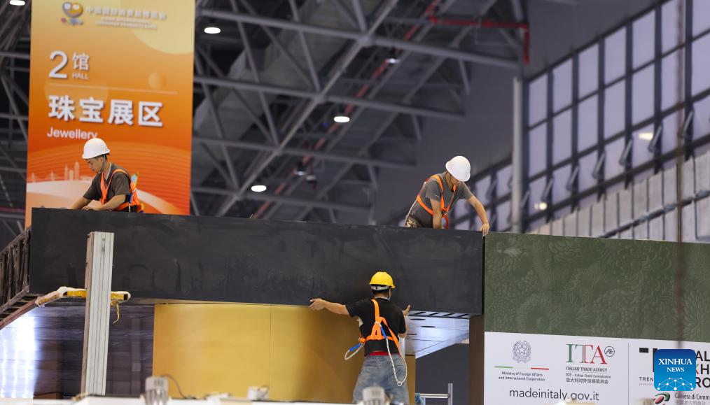 Workers perform tasks at Hainan International Convention and Exhibition Center, the main venue for the upcoming fourth China International Consumer Products Expo, in Haikou, south China's Hainan Province, April 8, 2024. /Xinhua