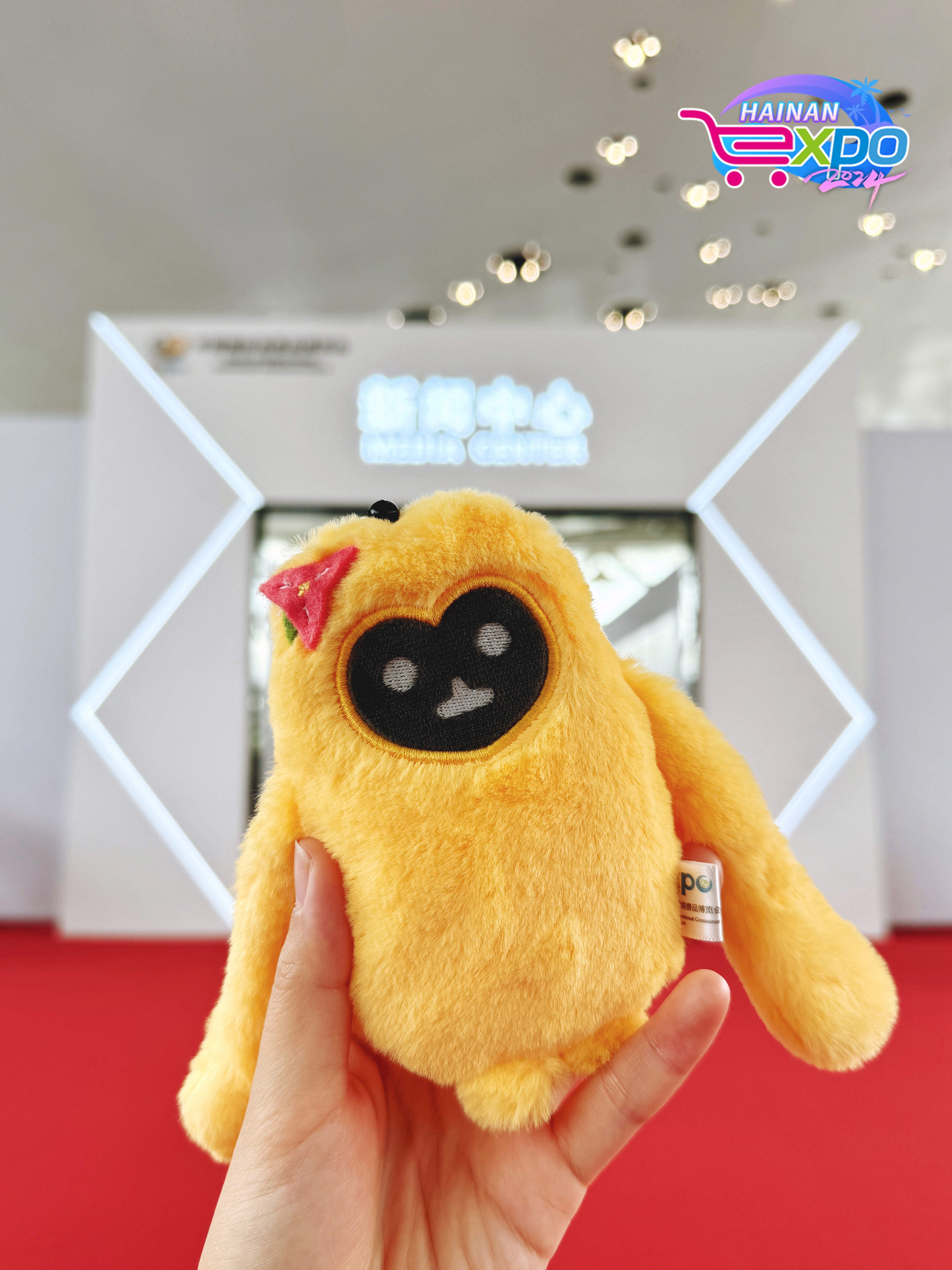A mascot of the fourth China International Consumer Products Expo is held in front of the media center, Haikou City, south China's Hainan Province, April 12, 2024. Guo Meiping/CGTN