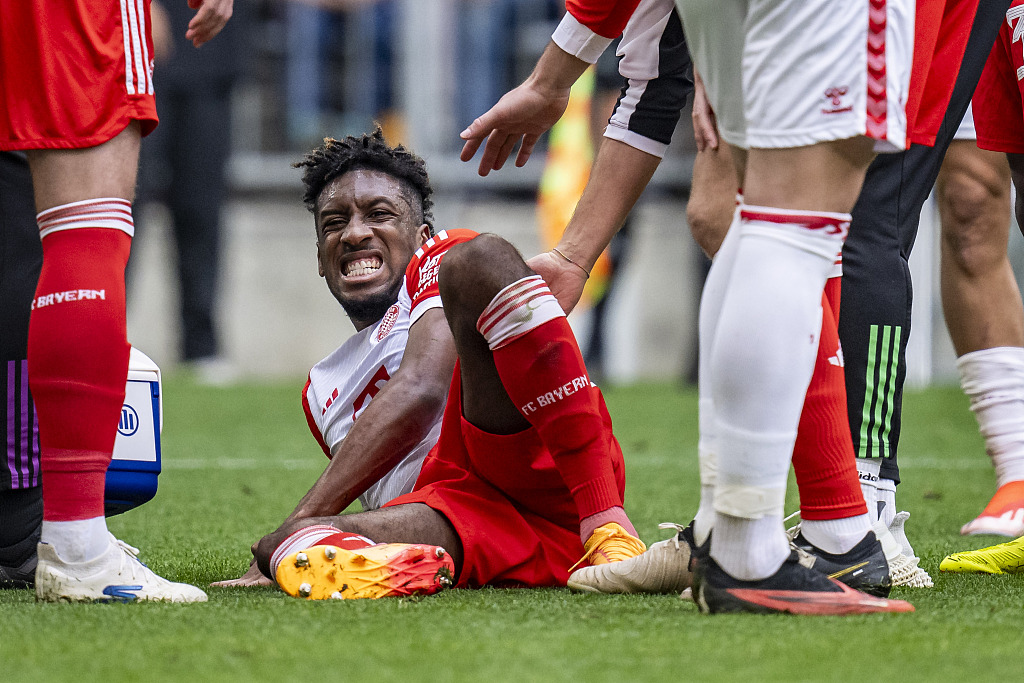 Kingsley Coman (C) of Bayern Munich lies on the field during the Bundesliga game against Cologne at the Allianz Arena in Munich, Germany, April 13, 2024. /CFP