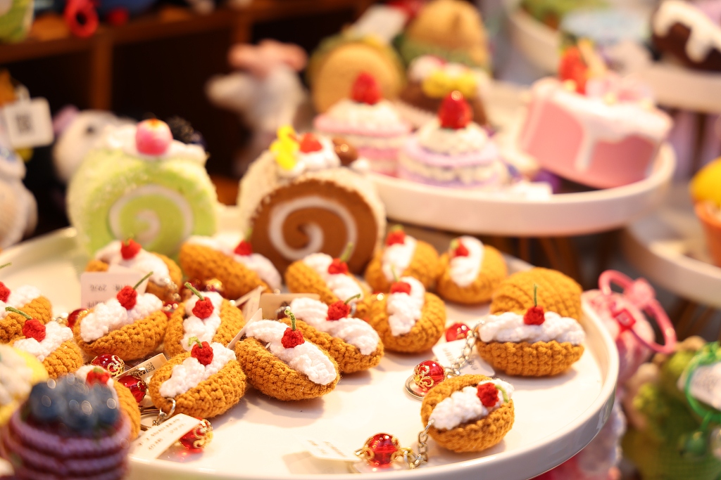 Decorative items shaped like desserts are seen during the Sugar Rush Festival at the Bund in Shanghai on April 13, 2024. /CFP