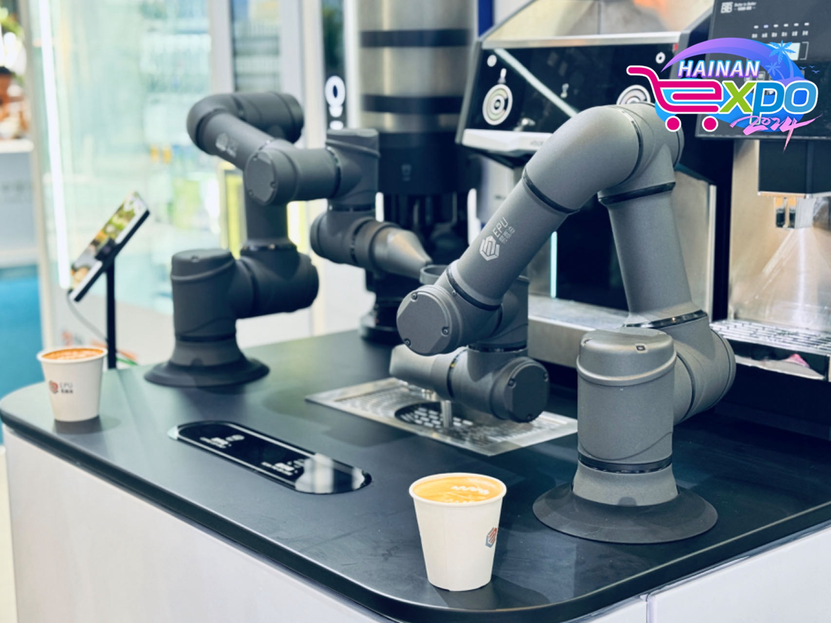 Robotic arms are seen making coffee at the fourth China International Consumer Products Expo, Haikou City, south China's Hainan Province, April 15, 2024. Guo Meiping/CGTN