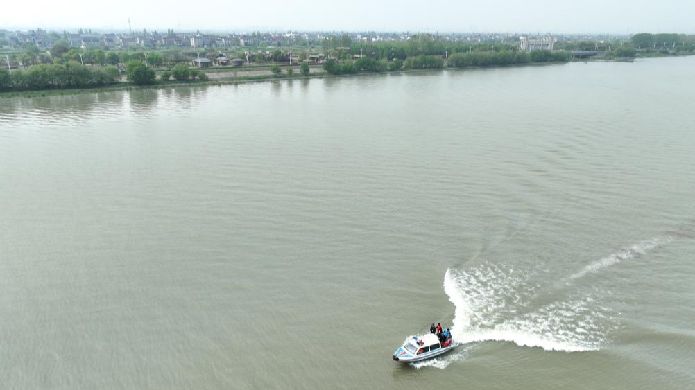 An aerial drone photo taken on April 11, 2024, shows staff members of an ecological police service team patrolling on Taihu Lake, Wuxing District of Huzhou City, east China's Zhejiang Province. /Xinhua