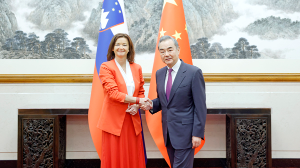 Chinese Foreign Minister Wang Yi (R), also a member of the Political Bureau of the Communist Party of China Central Committee, shakes hands with Slovenia's Deputy Prime Minister and Foreign Minister Tanja Fajon in Beijing, China, April 17, 2024. /Chinese Foreign Ministry