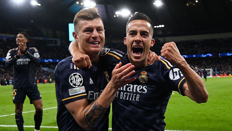 Real Madrid's Toni Kroos and Lucas Vazquez celebrate during their Champions League clash with Manchester City at the Etihad Stadium in Manchester, England, April 17, 2024. /CFP