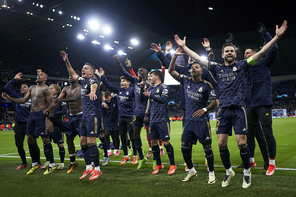 Real Madrid players celebrate victory after their Champions League clash with Manchester City at the Etihad Stadium in Manchester, England, April 17, 2024. /CFP