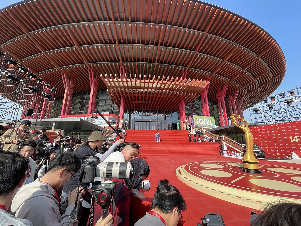 A photo taken on April 18, 2024 shows members of the media lining the red carpet at the opening ceremony of the 14th Beijing International Film Festival (BJIFF) in Beijing. /CFP