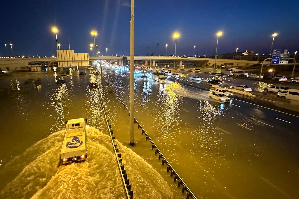 Vehicles drive on flooded streets following heavy rains in Dubai, United Arab Emirates, April 17, 2024. /CFP