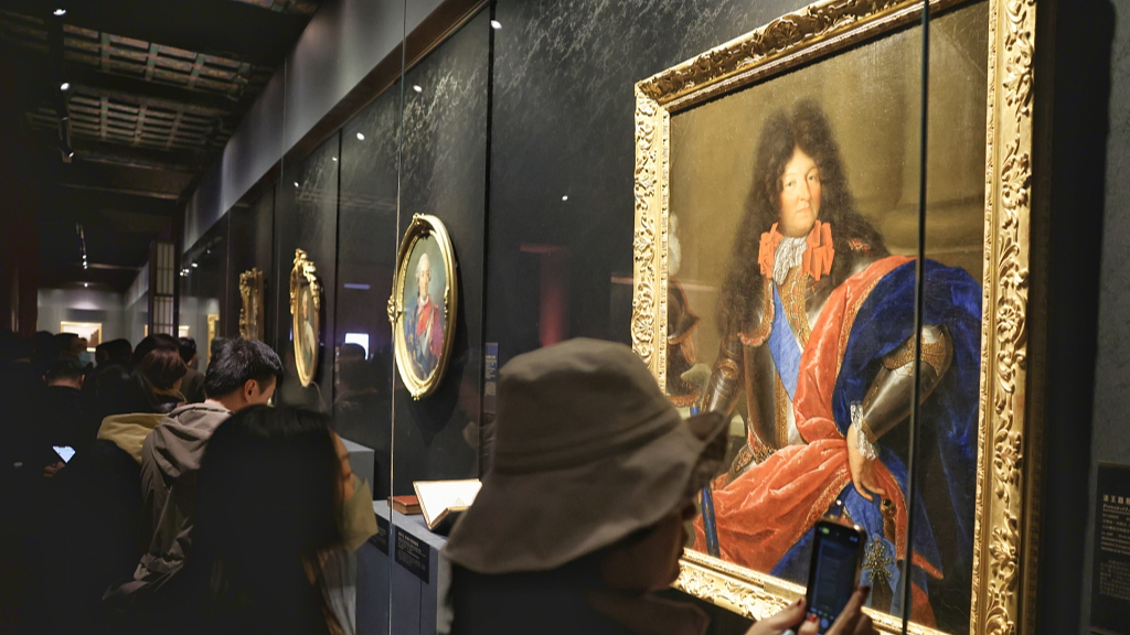 Visitors view a China-France cultural exchange exhibition at the Palace Museum in Beijing on April 1, 2024. /CFP