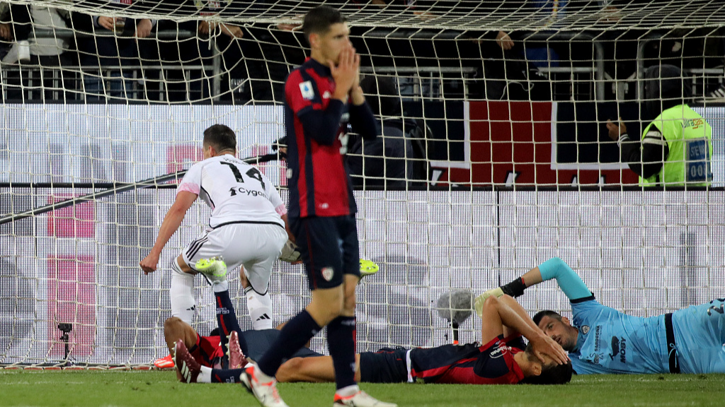 Dejected Cagliari players fall to the ground after an own goal gave Juventus a draw in their Serie A clash in Cagliari, Italy, April 19, 2024. /CFP
