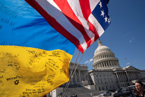 Flags of the United States and Ukraine are seen as people demonstrate outside the U.S. Capitol, April 20, 2024. /Reuters
