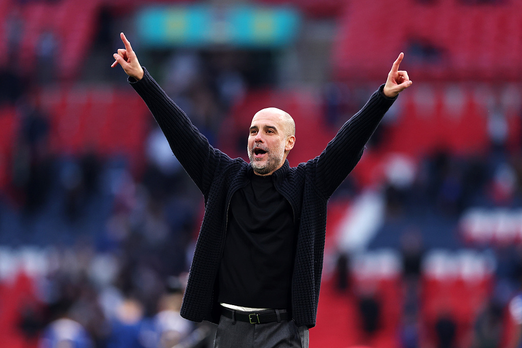 Manchester City manager Pep Guardiola celebrates after his team's victory at Wembley Stadium in London, England, April 20, 2024. /CFP