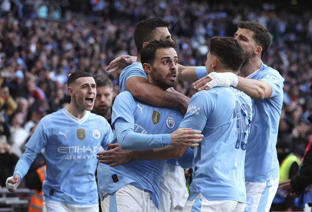 Manchester City players celebrate during their clash with Chelsea at Wembley Stadium in London, England, April 20, 2024. /CFP