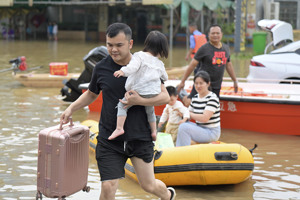 Residents evacuating in flood-hit Qingyuan City, Guangdong Province, south China, April 22, 2024. /CFP
