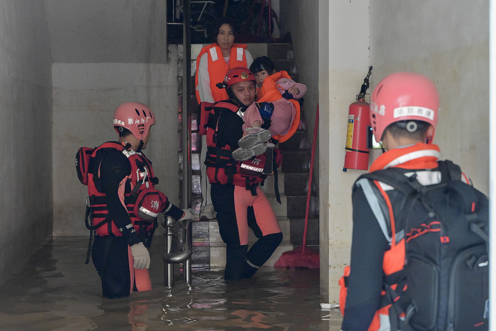 Rescuers evacuating residents in flood-hit Qingyuan City, Guangdong Province, south China, April 22, 2024. /CFP