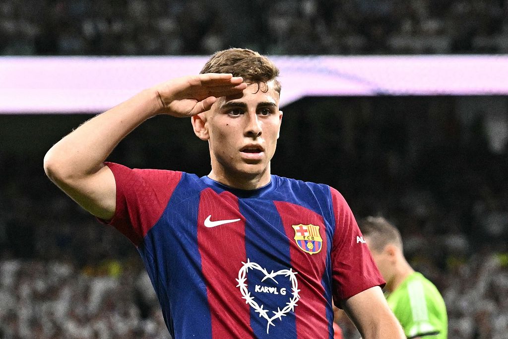 Barcelona's Fermin Lopez celebrates scoring his team's second goal during their clash with Real Madrid at the Santiago Bernabeu stadium in Madrid, Spain, April 21, 2024. /CFP