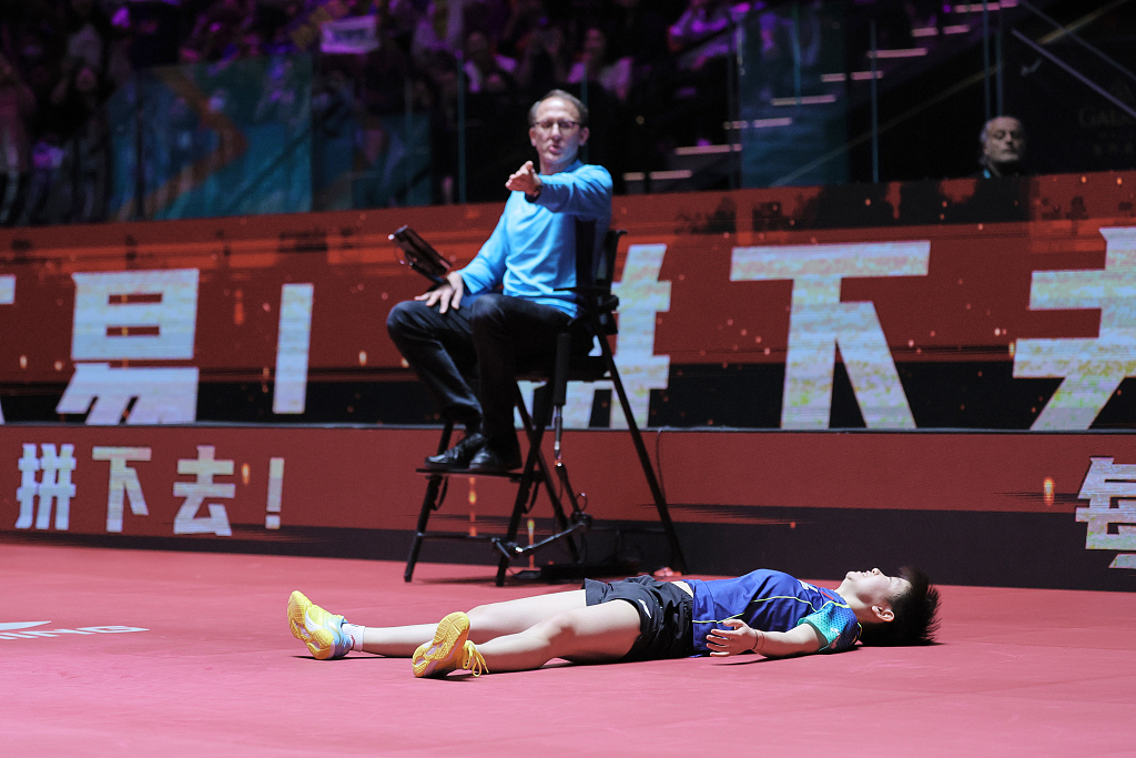 China's Sun Yingsha collapses onto the court after winning the women's singles final at the ITTF World Cup in Macao Special Administrative Region, China, April 21, 2024. /CFP