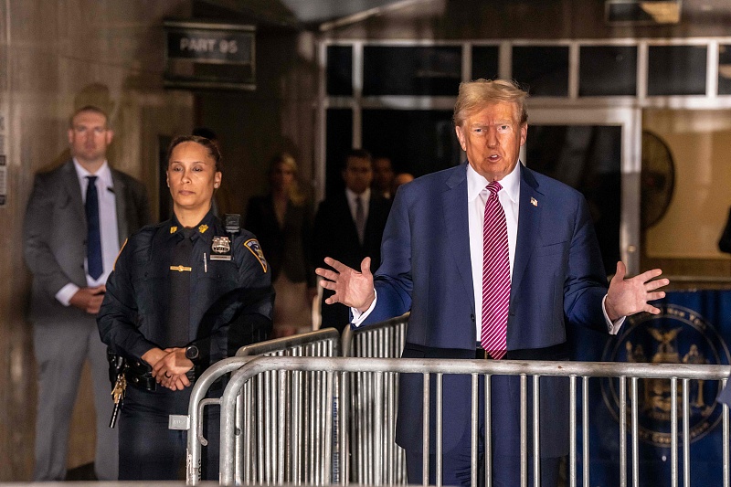 Former U.S. President Donald Trump speaks to the press before entering the courtroom in his trial for allegedly covering up hush money payments linked to extramarital affairs at the Manhattan Criminal Court in New York City, April 19, 2024. /CFP