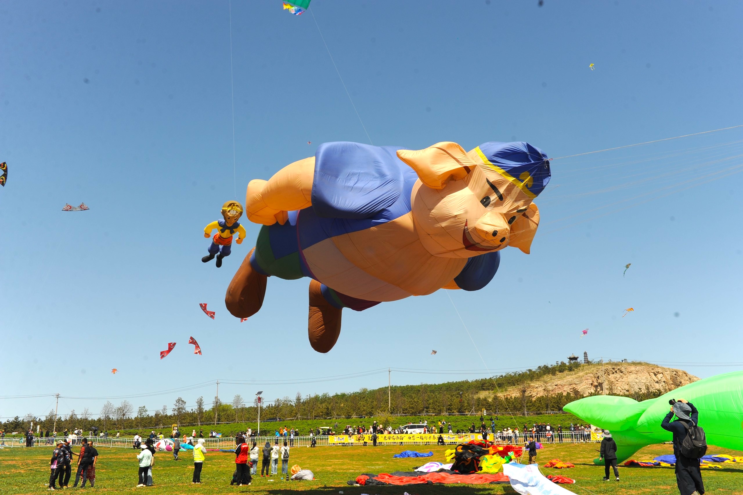 Kites in the shape of characters from the TV series adapted from the Chinese classic novel 