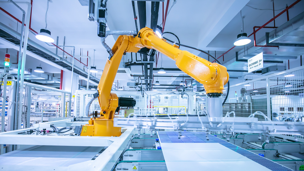 File photo: An industrial robotic arm producing solar panels on a factory assembly line. /CFP