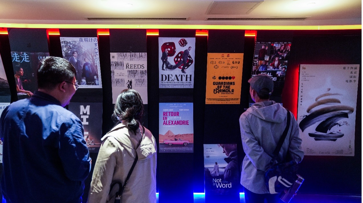Movie fans enjoy the films and interact with the film crew at the movie theater, April 24, 2024. Chen Bo/CGTN