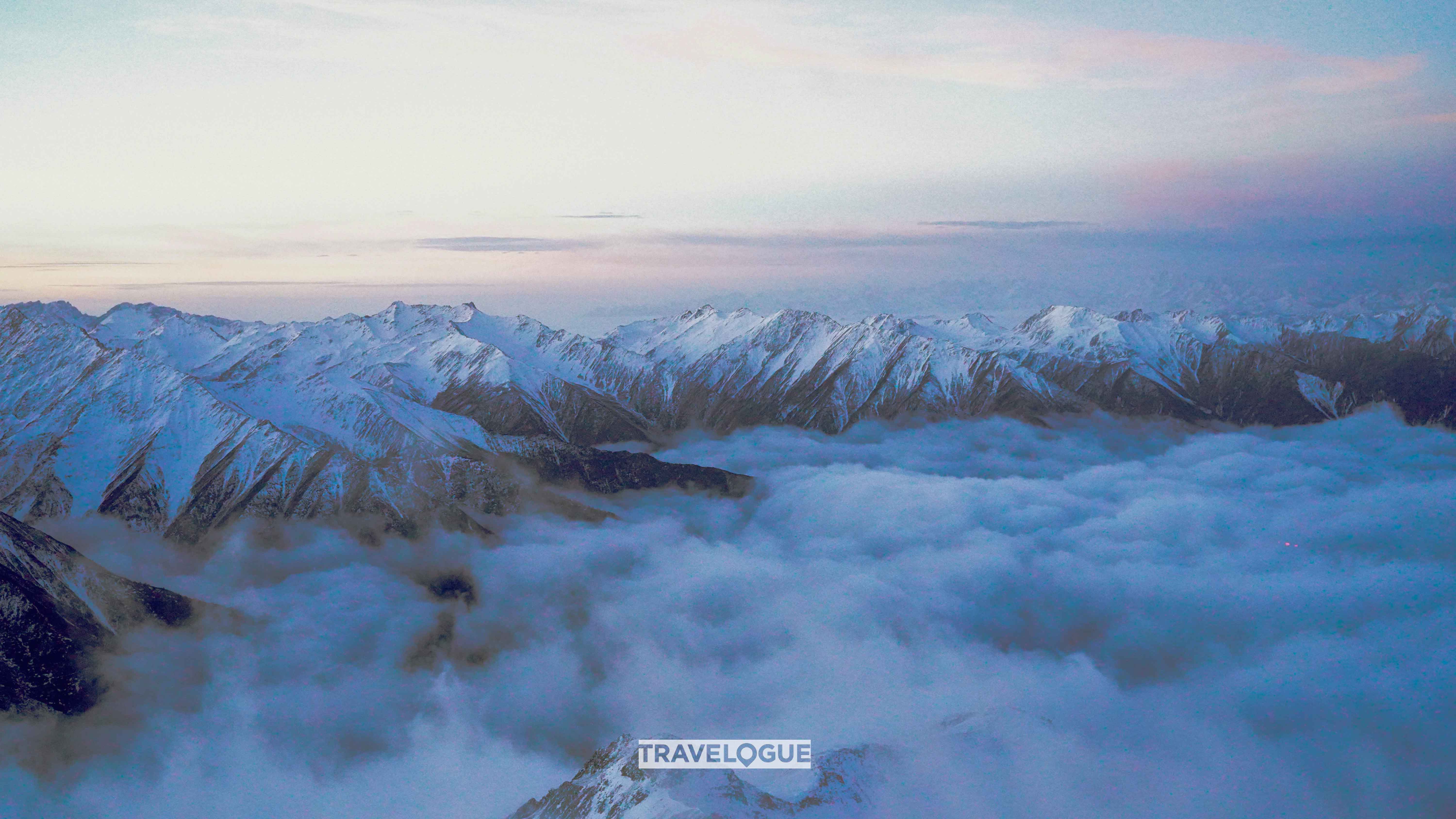 Seas of clouds form beneath the First Peak of Mount Siguniang in southwest China's Sichuan Province. /CGTN