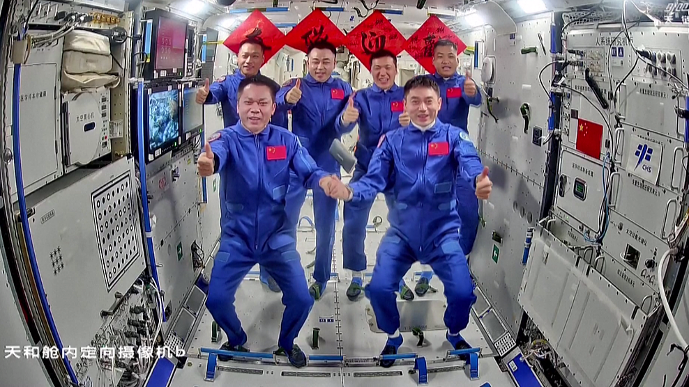 A group photo of China's Shenzhou-17 and Shenzhou-18 crews in the space station. /CFP