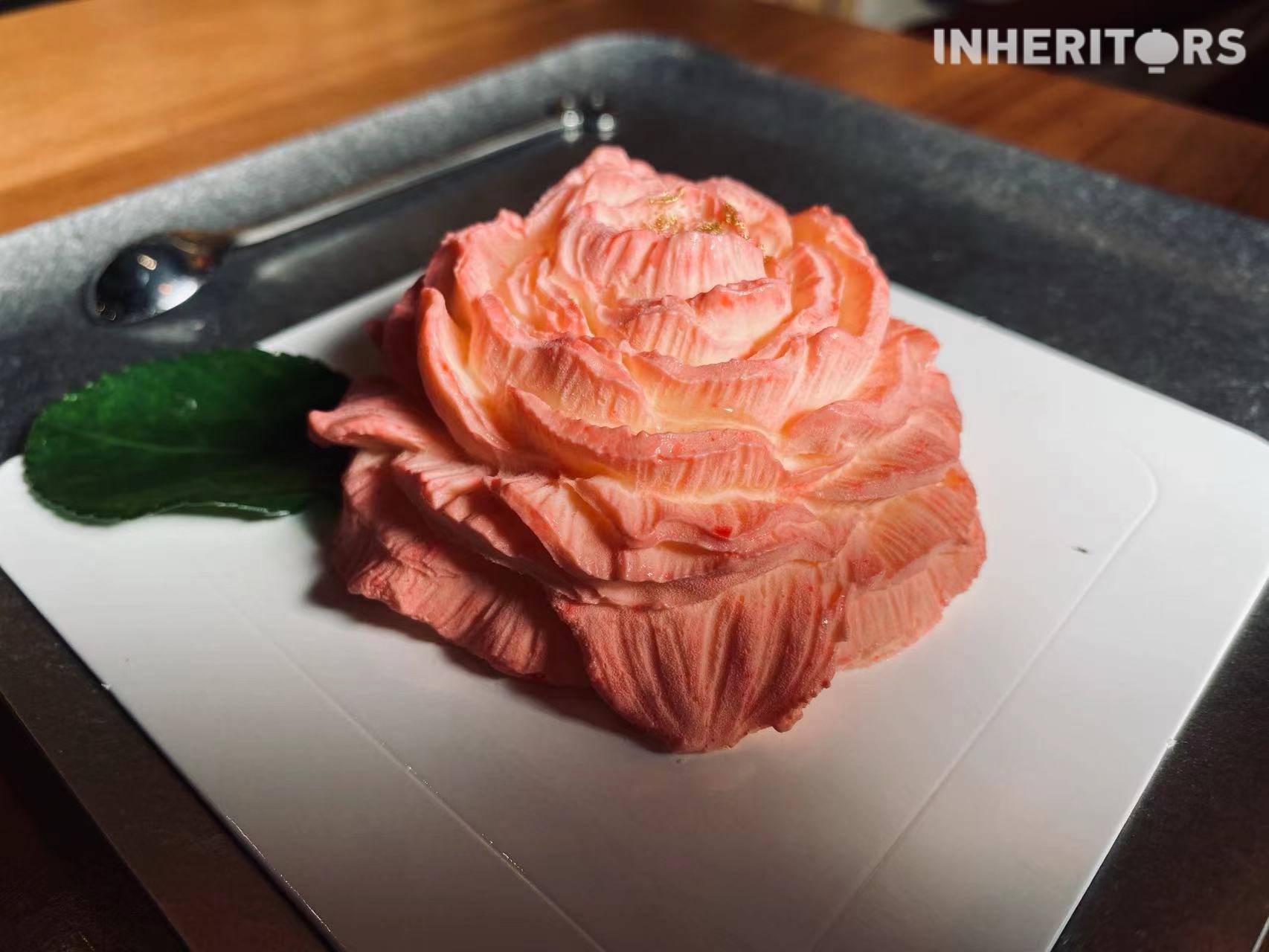 A sumptuous cake shaped like a peony at a coffee shop in Luoyang, Henan Province. /CGTN