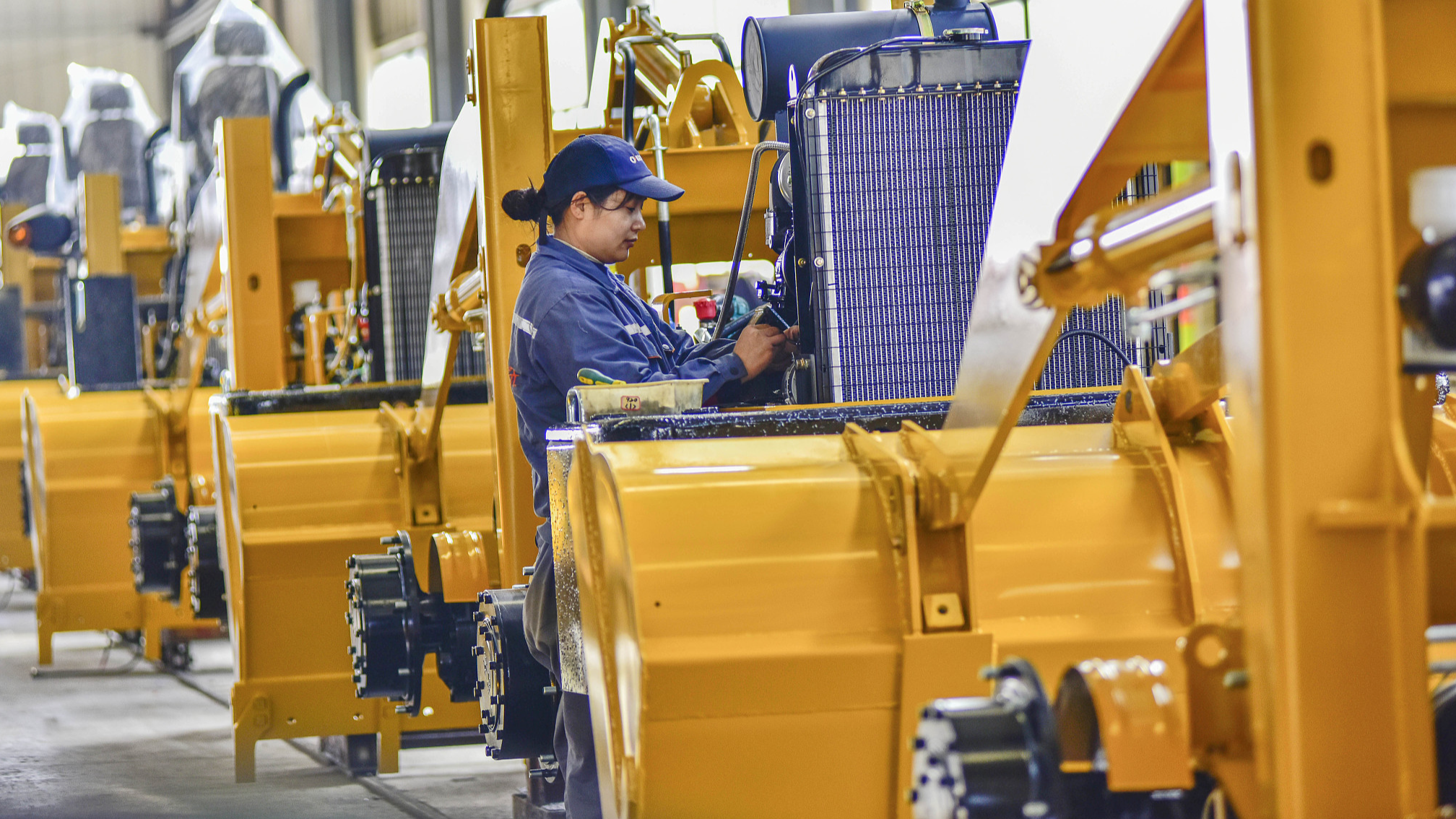 A worker on the assembly line of a loader manufacturing enterprise in Qingzhou City, Shandong Province on March 27, 2024. /CFP