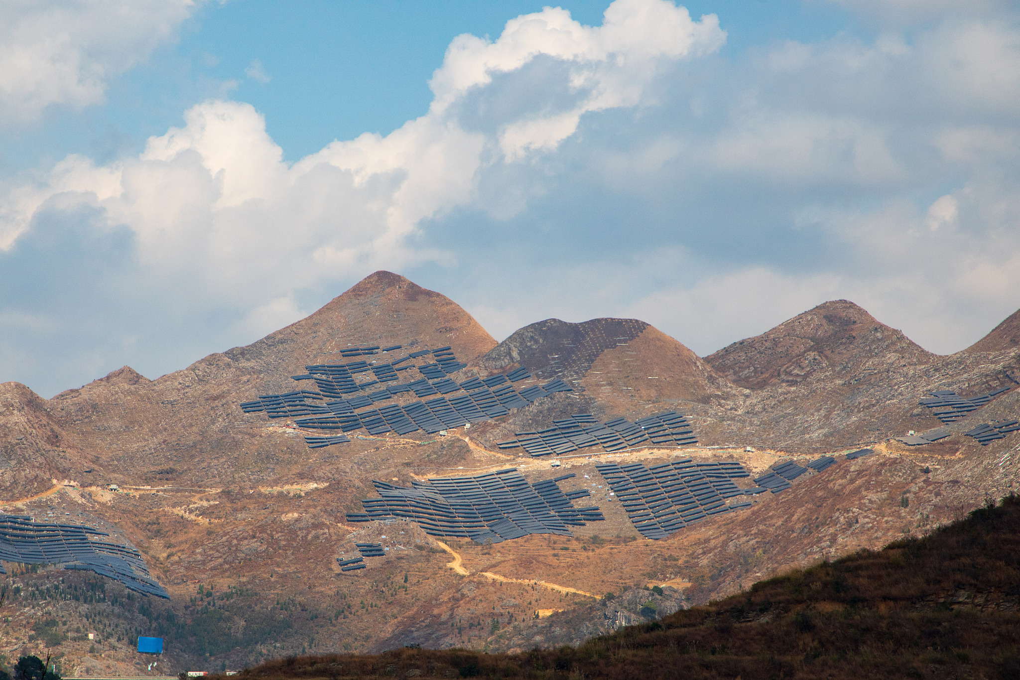 Photovoltaic panels spread all over the mountains and plains in southwest China's Guizhou Province, January 1, 2024. /CFP