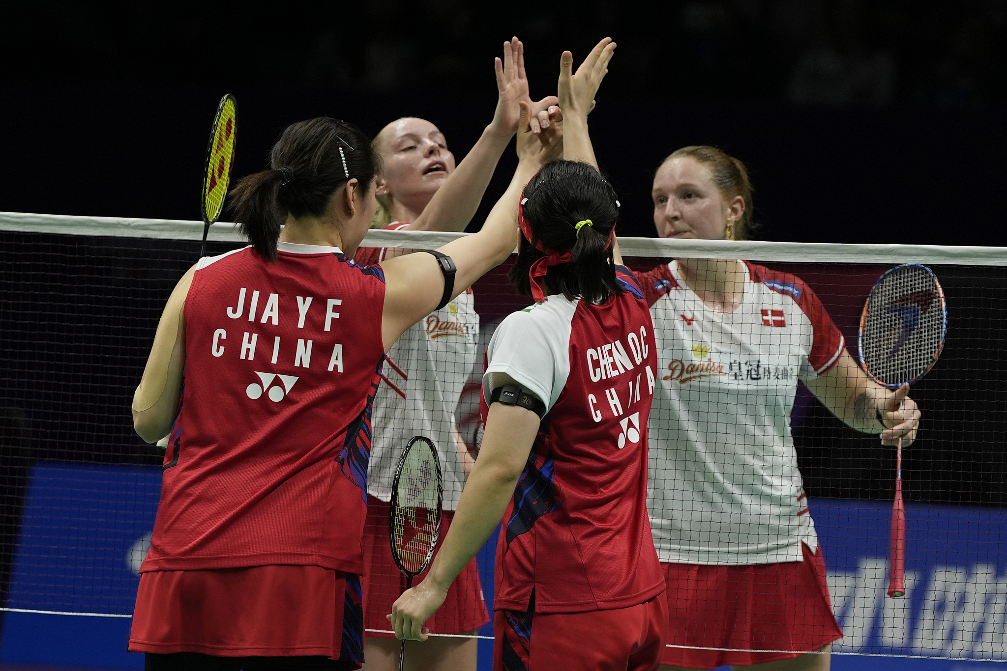 Jia Yifan (L) and Chen Qingchen of China greet Denmark's players after their second-round women's doubles match during the Uber Cup quarterfinal in Chengdu, China, May 2, 2024. /CFP