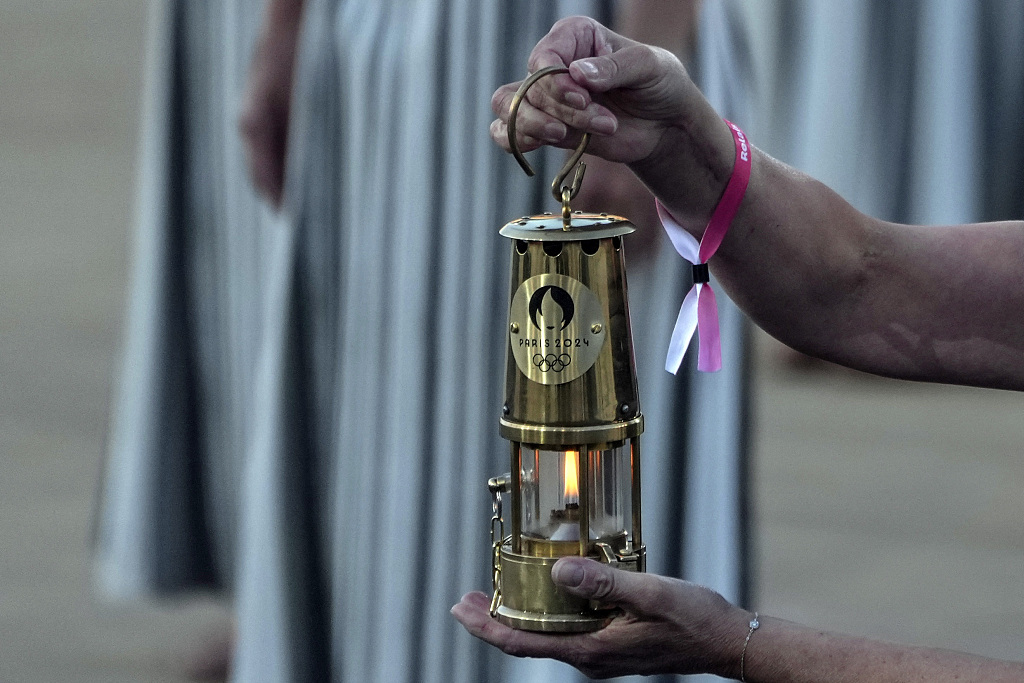 The Olympic flame for the 2024 Summer Olympic Games is handed over to the Paris organizing committee in Athens, Greece, April 26, 2024. /CFP