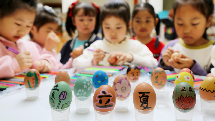 Children experience traditional customs to welcome Start of Summer - CGTN