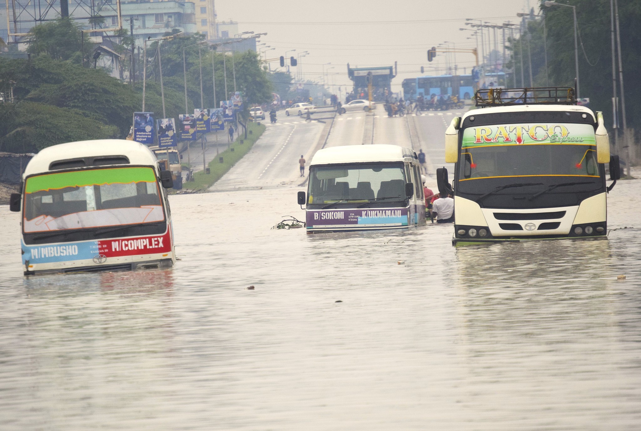 Public minibuses are submerged in the flooded streets of Dar es Salaam, Tanzania, April 25, 2024. /CFP
