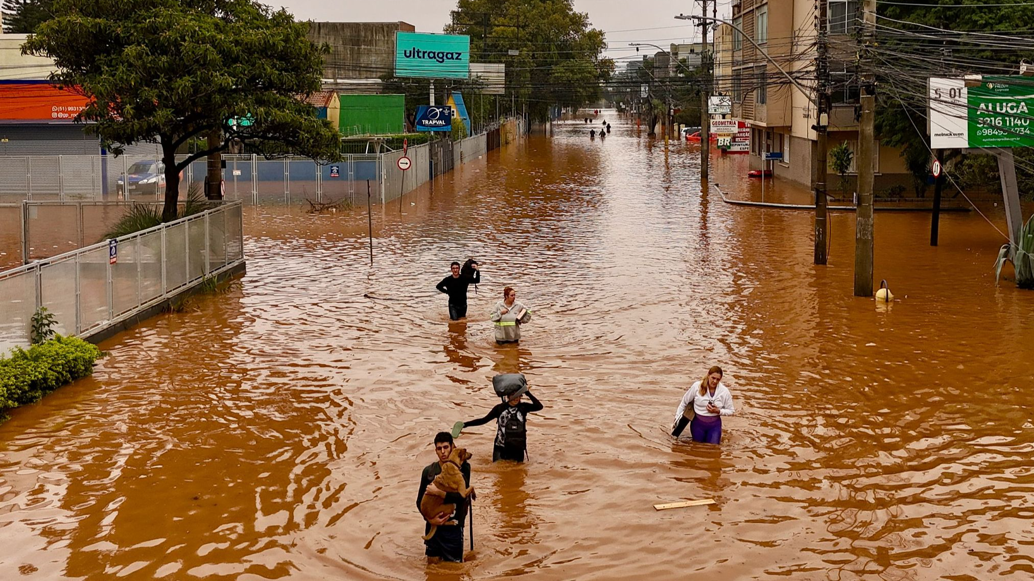 Aerial view of people walking through a flooded street at the Navegantes neighborhood in Porto Alegre, Brazil, May 4, 2024. /CFP