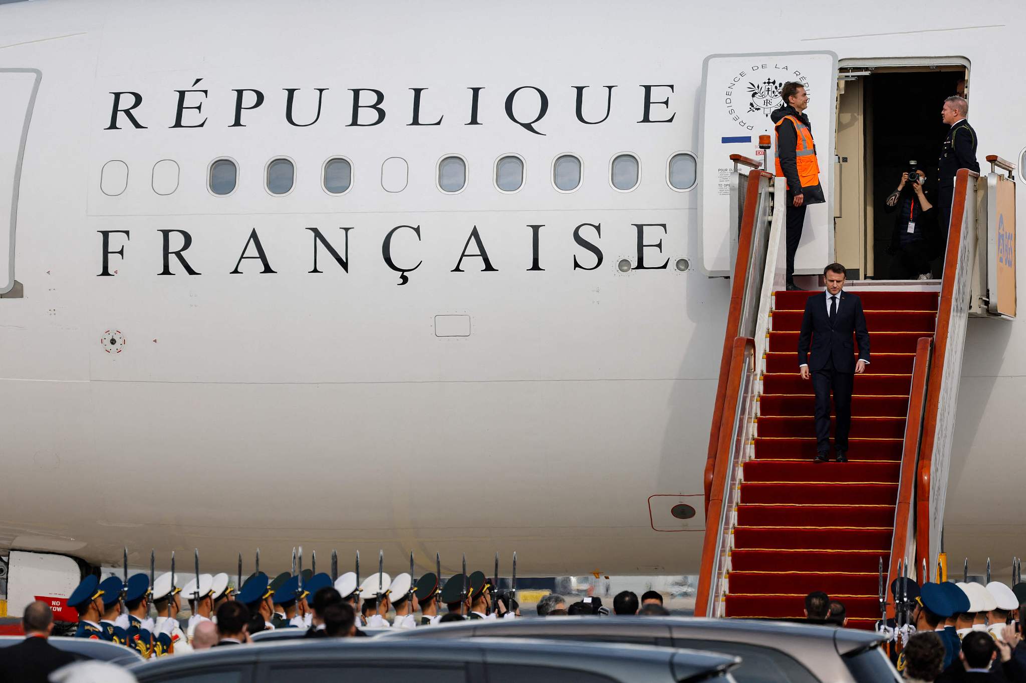 French President Emmanuel Macron disembarks his presidential plane at Beijing Capital International Airport in Beijing, capital of China, April 5, 2023. /CFP