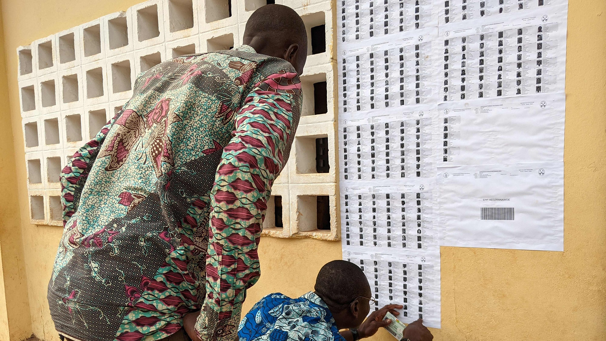 Voters look for their names at a polling station at the Hedzranawoe public primary school in Lome during Togo's legislative elections, April 29, 2024. /CFP