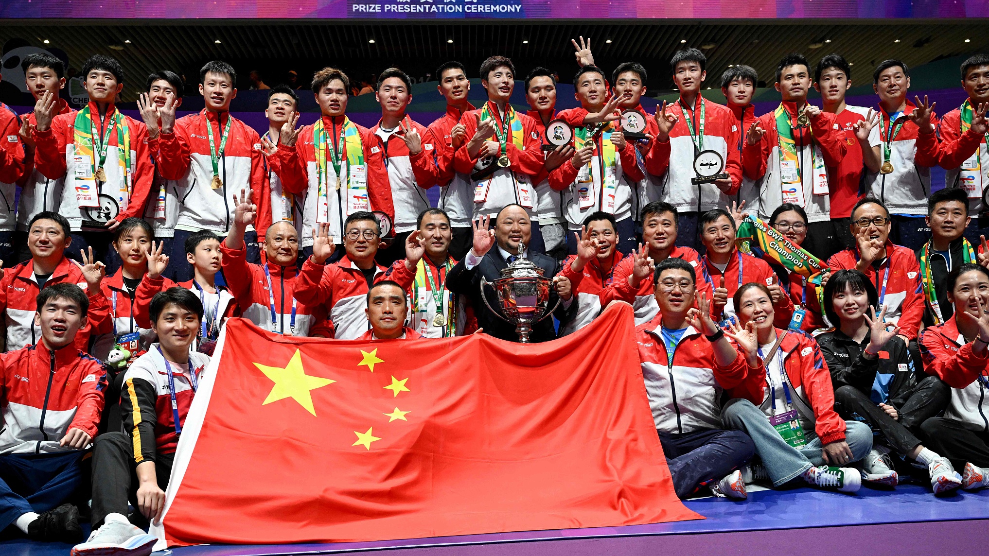 China's team members pose for a picture after their victory over Indonesia in the Thomas and Uber Cup badminton tournament in Chengdu, China, May 5, 2024. /CFP