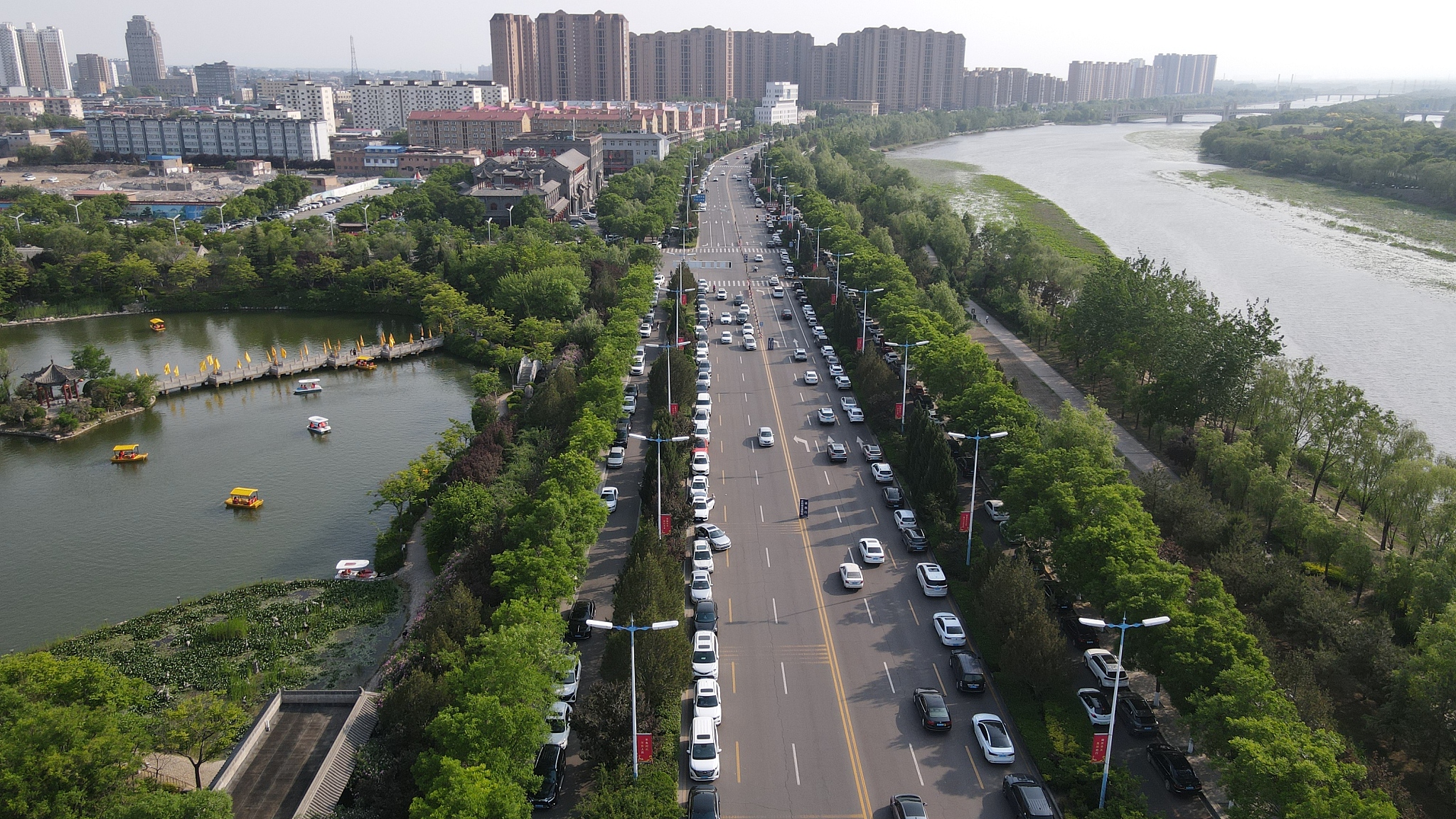 The parking lots were full on both sides of the road, Shanxi Province, May 2, 2024. /CFP